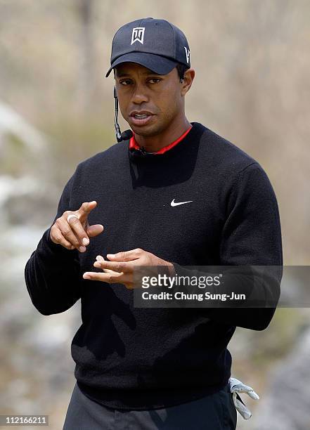 Golfer Tiger Woods speaks in a golf teaching clinic for South Korean juniors during a Nike Golf "Make It Happen" event at Jade Palace Golf Club on...
