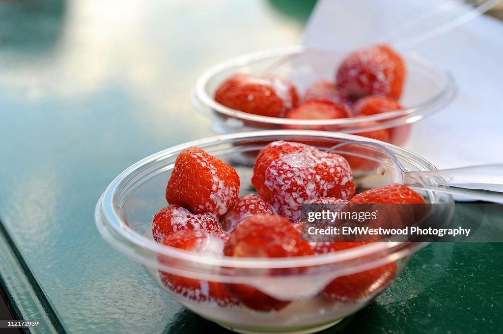 Strawberries and cream in acrylic bowls