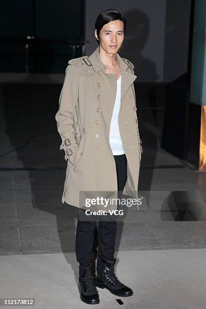 South Korean actor Won Bin poses for photos as he arrives at the corporate event of the fashion apparel company Burberry at Sparkle Roll Plaza on...