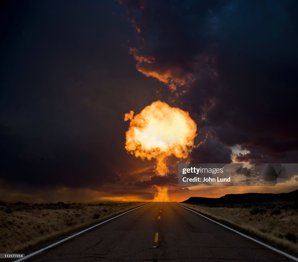 Fireball exploding over a long road.