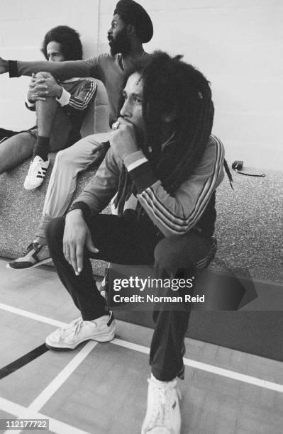 Jamaican singer-songwriter Bob Marley takes a break during a football match against a team led by fellow reggae artist Eddy Grant, Hammersmith...