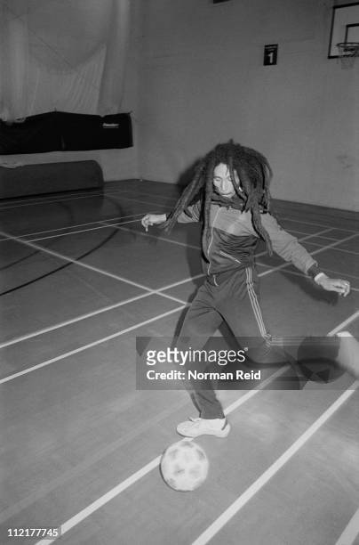 Jamaican singer-songwriter Bob Marley playing in a football match against a team led by fellow reggae artist Eddy Grant, Hammersmith Leisure Centre,...