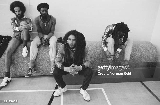 Jamaican singer-songwriter Bob Marley takes a break during a football match against a team led by fellow reggae artist Eddy Grant, Hammersmith...