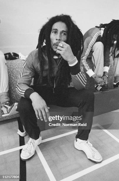 Jamaican singer-songwriter Bob Marley takes a break during a football match against a team led by fellow reggae artist Eddy Grant, Hammersmith...