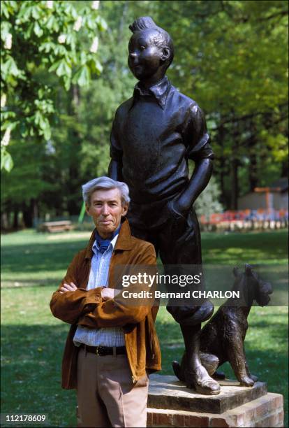 Herge stands in front of a Tintin statue on May 13, 1982 in Brussels,Belgium.