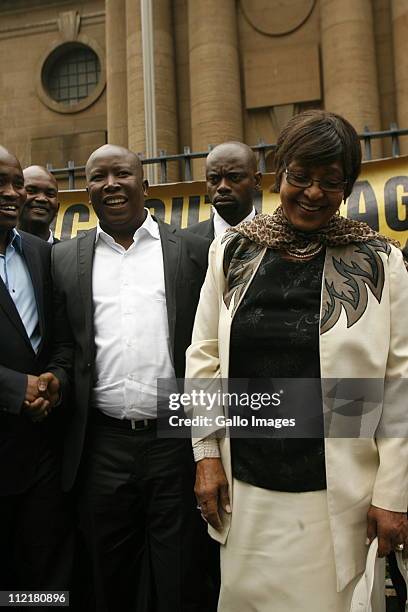 Youth League leader Julius Malema and ANC stalwart Winnie Mandela stand outside the Johannesburg high court on April 13, 2011 in Johannesburg, South...