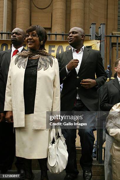 Stalwart Winnie Mandela and ANC political spokesperson Floyd Shivambu stand outside the Johannesburg high court on April 13, 2011 in Johannesburg,...