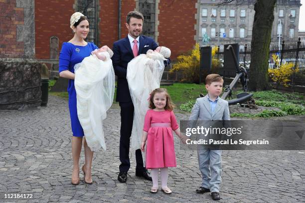 Crown Princess Mary and Crown Prince Frederik of Denmark with Princess Isabella and Prince Christian pose after the christening of their twins Prince...