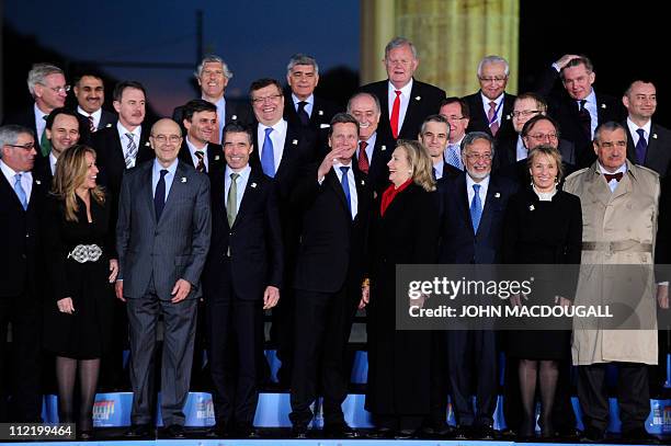 German Foreign Minister and vice-chancellor Guido Westerwelle chats with US Secretary of State Hillary Clinton alongside NATO Secretary General...