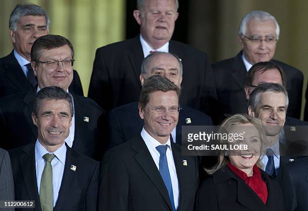 Secretary of State Hillary Clinton stands alongside German Foreign Minister Guido Westerwelle , NATO Secretary General Anders Fogh Rasmussen and...