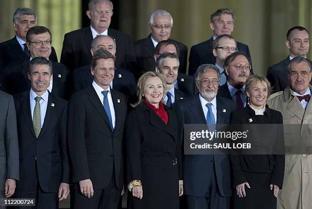 Secretary of State Hillary Clinton stands alongside German Foreign Minister Guido Westerwelle , NATO Secretary General Anders Fogh Rasmussen and...