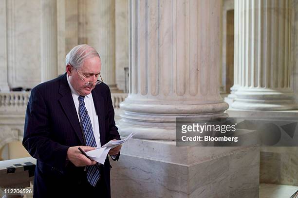 Senator Carl Levin, a Democrat from Michigan, prepares to speak for a Bloomberg Television interview in the Russell building rotunda of the Capitol...