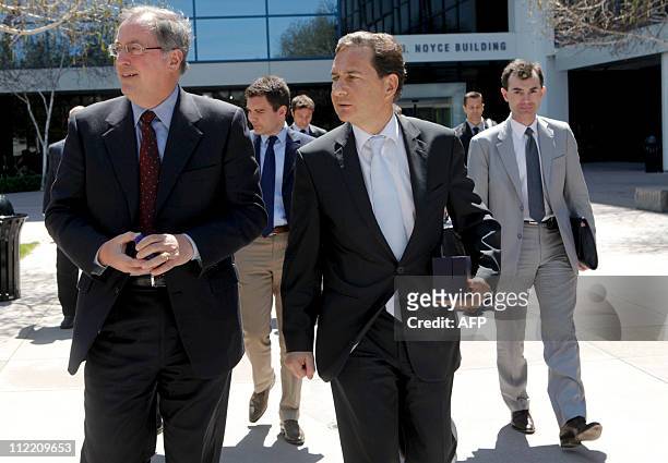 Eric Besson , the French Minister for Industry, Energy, and Digital Economy, walks with Paul Otellini , chief executive officer of Intel, outside...