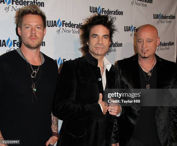 Drummer Scott Underwood, singer Pat Monahan, and guitarist Jimmy Stafford of Train attend the 2011 UJA-Federation of New York's Broadcast, Cable, and...