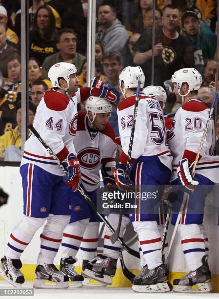 Brian Gionta of the Montreal Canadiens is congratulated by teammates Roman Hamrlik,Scott Gomez,Mathieu Darche and James Wisniewski after Gionta...