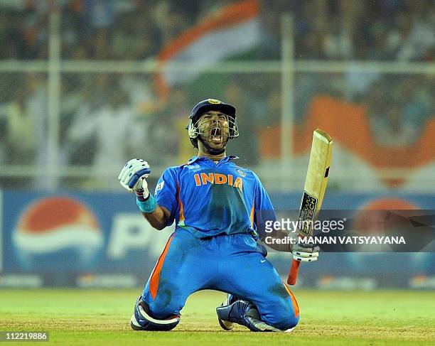 Indian batsman Yuvraj Singh celebrates after beating Australia during the quarter-final match of The ICC Cricket World Cup 2011 between India and...