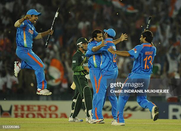 Indian cricketers Suresh Raina Zaheer Khan yuvraj Singh and Munaf Patel celebrate after winning the second semi-final match of The ICC Cricket World...