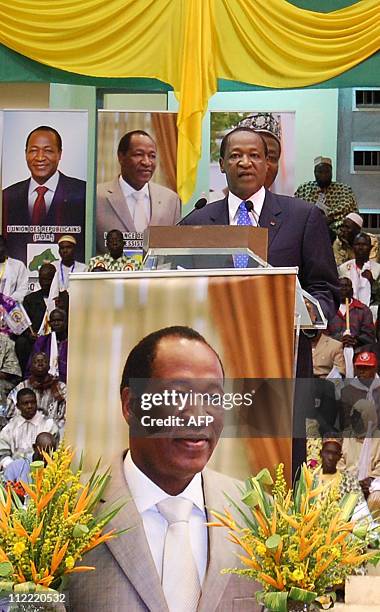 Head of state of Burkina Faso since 1987 Blaise Compaore, looks on after announcing his candidacy in Ouagadougou on August 21 for the forthcoming...
