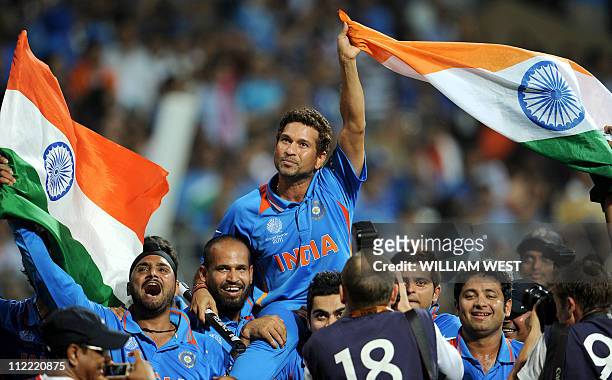 Indian batsman Sachin Tendulkar is carried on his teammates shoulders after India defeated Sri Lanka in the ICC Cricket World Cup 2011 final played...