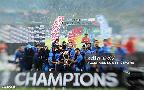 In this image taken with a Tilt and Shift Lens, Indian cricketers celebrate with the trophy after beating Sri Lanka in the ICC Cricket World Cup 2011...