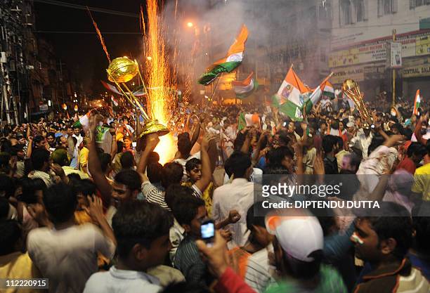 Indian cricket fans celebrate victory over Sri Lanka in Siliguri on April 2 after the ICC Cricket World Cup 2011 final match between India and Sri...