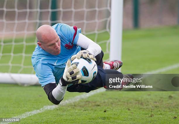 Goalkeeper Brad Friedel in action during an Aston Villa training session at the club's training ground at Bodymoor Heath on April 15, 2011 in...