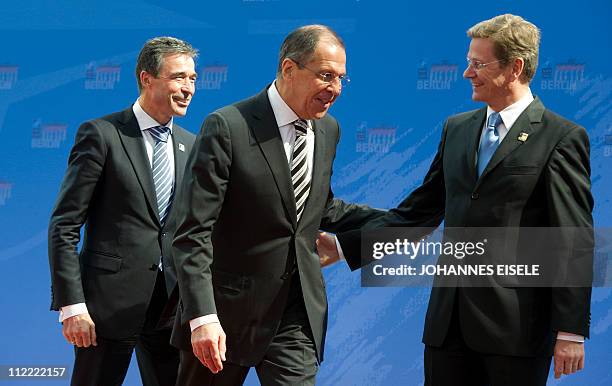 Russian Foreign Minister Sergei Lavrov is welcomed by German Foreign Minister Guido Westerwelle and NATO Secretary General Anders Fogh Rasmussen...