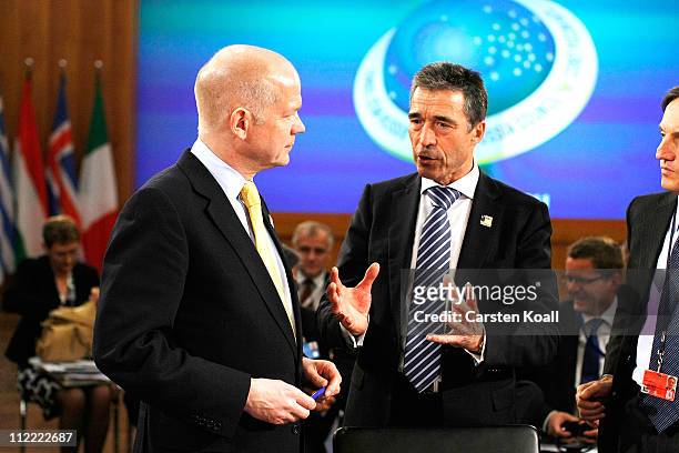 Secretary General Anders Fogh Rasmussen talks with U.K. Foreign Secretary William Hague at an informal meeting of NATO member foreign ministers on...