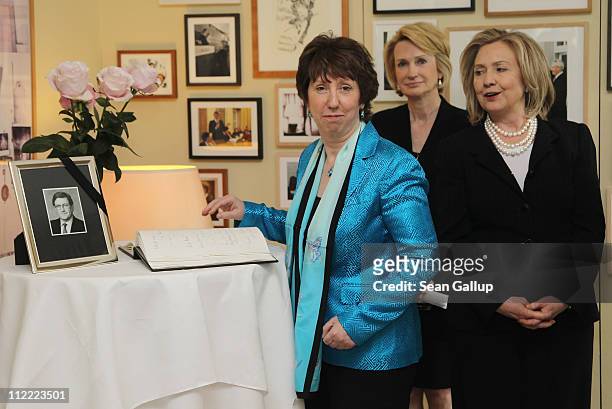 Secretary of State Hillary Clinton and High Representative of the European Commission Lady Catherine Ashton sign a book of condolences as American...