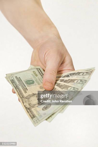 hands holding us dollars - 20 dollars stock pictures, royalty-free photos & images