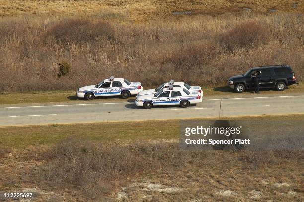 An aerial view of police cars near where a body was discovered in the area near Gilgo Beach and Ocean Parkway on Long Island on April 15, 2011 in...