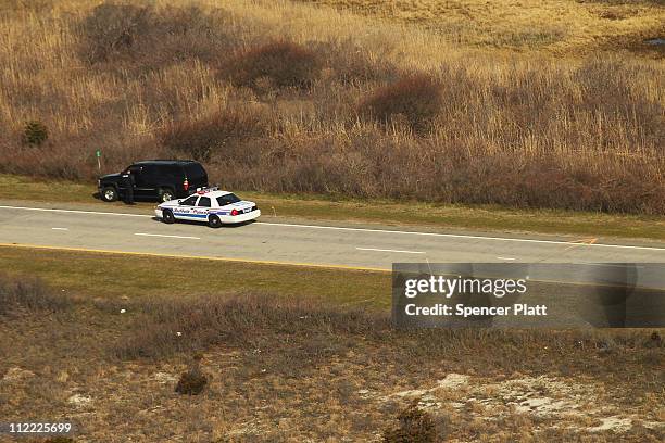 An aerial view of police cars near where a body was discovered in the area near Gilgo Beach and Ocean Parkway on Long Island on April 15, 2011 in...