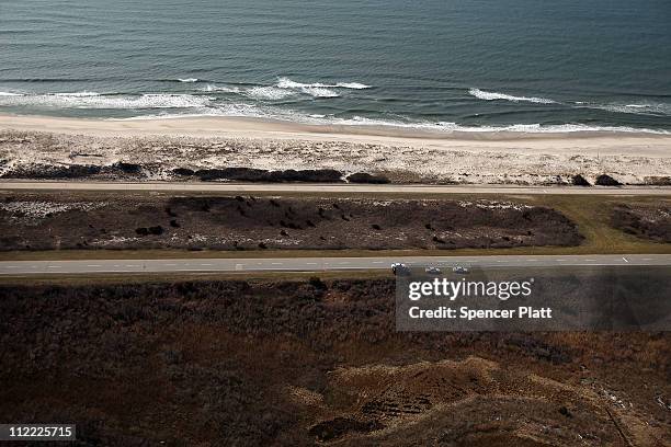 An aerial view of the area near Gilgo Beach and Ocean Parkway on Long Island where police have been conducting a prolonged search after finding ten...