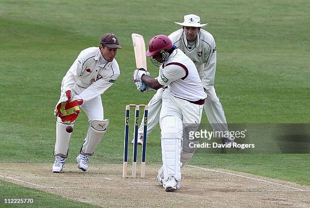 Chaminda Vaas of Northamptonshire plays the ball past Kent wicket keeper Geraint Jones during the LV County Championship Division Two match between...