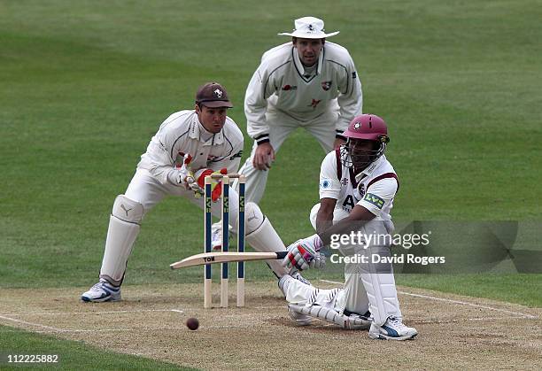 Chaminda Vaas of Northamptonshire sweeps the ball past Kent wicket keeper Geraint Jones during the LV County Championship Division Two match between...