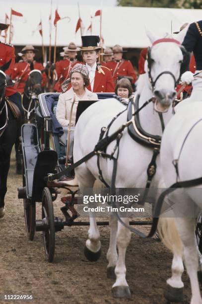 Queen Elizabeth II sitting alongside Lady Sarah Armstrong-Jones, daughter of Princess Margaret, in a horsedrawn carriage at the Royal Windsor Horse...