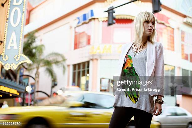 caucasian woman standing on city street - blonde hair woman city stock pictures, royalty-free photos & images