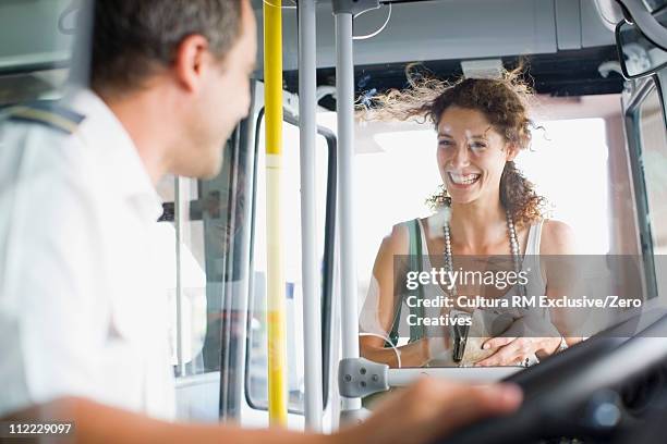 woman entering a bus - autista di autobus foto e immagini stock