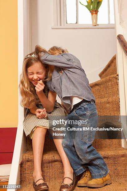 kids playing on stairs - boys wrestling stockfoto's en -beelden