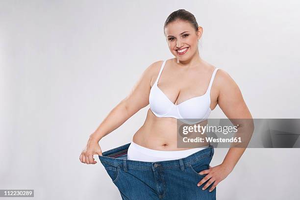 Young Chubby Woman With Oversized Pant Portrait High-Res Stock