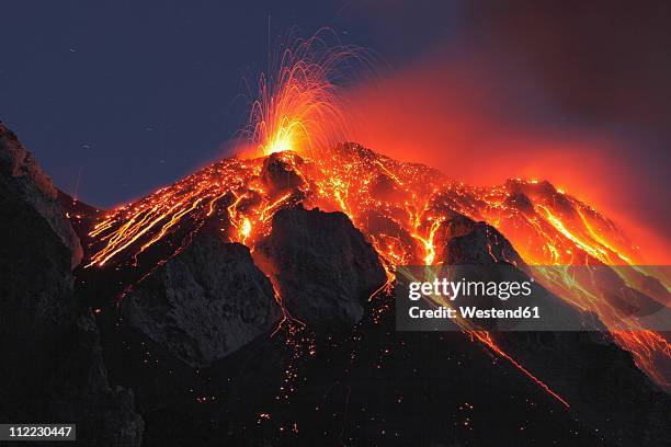 italy, sicily, lava flow from stromboli volcano - volcano erupting imagens e fotografias de stock