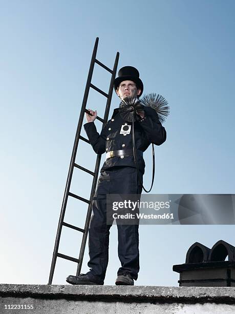 germany, chimney sweep with broom and ladder - chimney sweep stock pictures, royalty-free photos & images