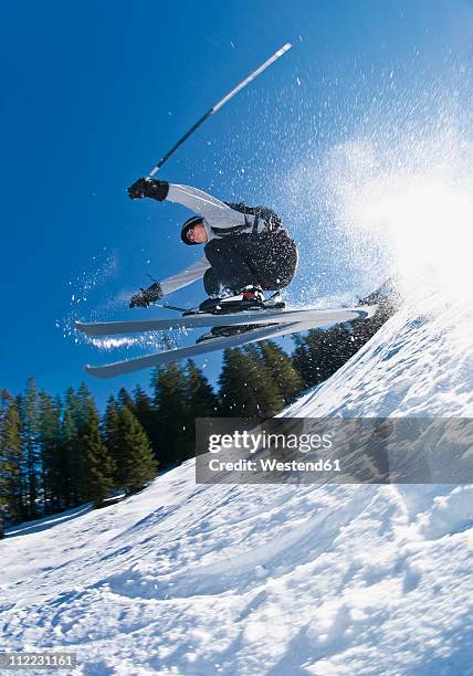 austria, skier doing ski jumping - スキー　ジャンプ ストックフォトと画像