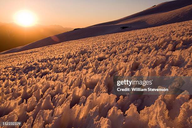 a snow field of penitentes-a conditon caused by differential melting- on volcan san jose in the andes mountains of chile - penitentes stockfoto's en -beelden