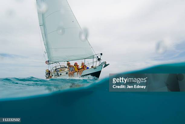 a family out for a day sail in georgetown, exumas - kid sailing stock-fotos und bilder
