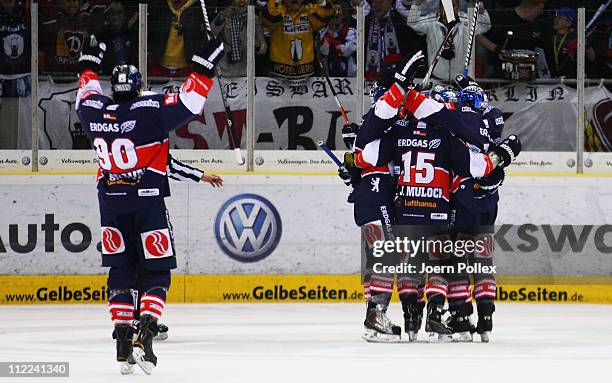 Of Berlin celebrates with his team mates after he scored his team's fourth goal during the first DEL play off final match between Grizzly Adams...