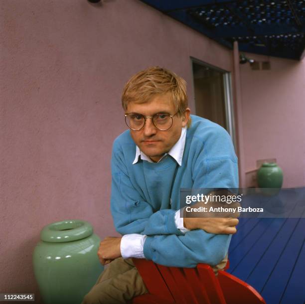 Portrait of English painter David Hockney, wearing a light blue sweatshirt, Los Angeles, CA, late twentieth century.