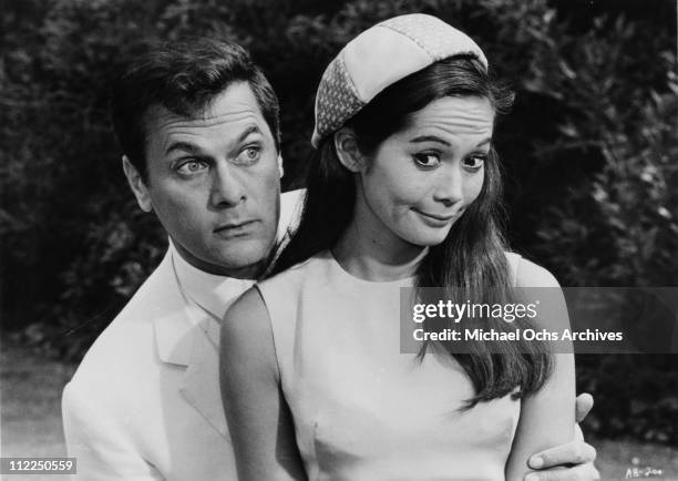 Actors Tony Curtis and Nancy Kwan in a scene from the movie 'Arrivederci, Baby!' in 1966.