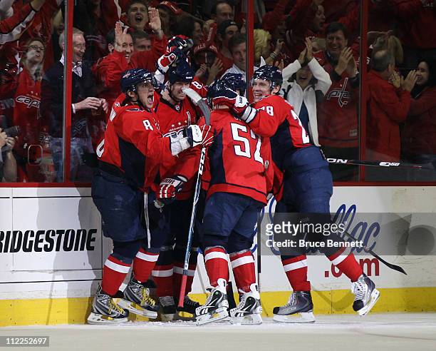 Alex Ovechkin and the Washington Capitals celebrate a goal by Jason Arnott at 4:08 of the second period against the New York Rangers in Game Two of...