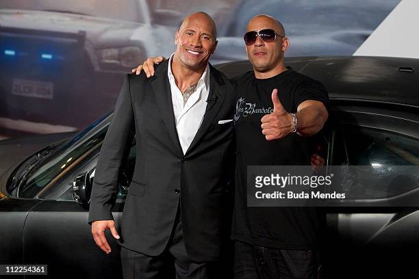 Dwayne Johnson and Vin Diesel pose for photographers during the premiere of the movie "Fast and Furious 5" at Cinepolis Lagoon on April 15, 2011 in...